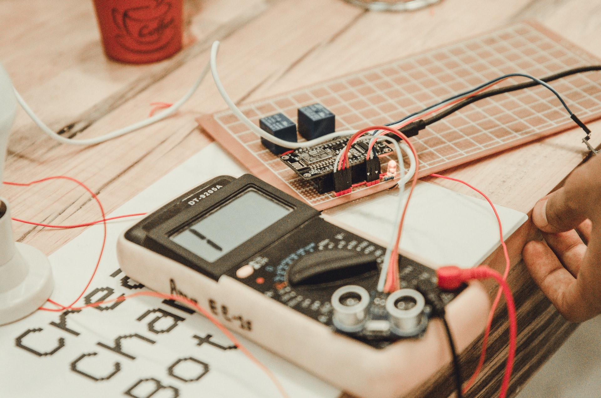 Download Electrician Checking Wires Wallpaper | Wallpapers.com